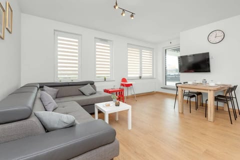 Relax in the stylish living room with a comfortable sofa and modern decor.