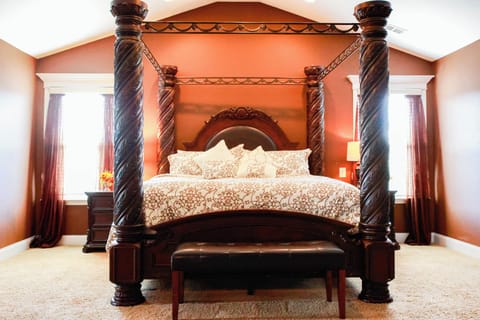 King bed in Master bedroom w/ sitting area & full-size pull-out sofa. 
