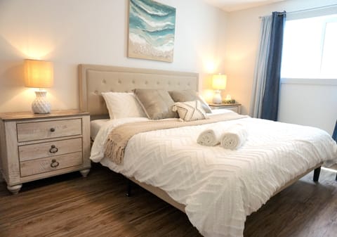 Bedroom with King-size mattress. Extra towels are provided.