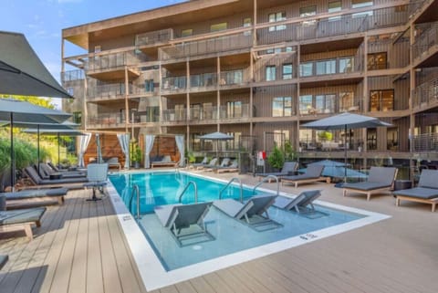 Community Pool w/ cabanas and lounge chairs  open from March to October