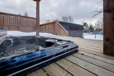 Soak and unwind in the spacious hot tub, the perfect place to relax after a day of exploring.