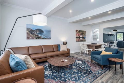 Spacious living area blending contemporary style with warm, comfortable seating.