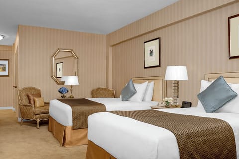 Gather comfortably with twin beds and cozy seating nearby.