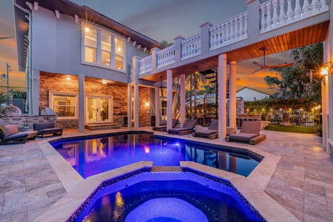 Soak in the spa glow and poolside luxury as the sun sets on your private tropical retreat.