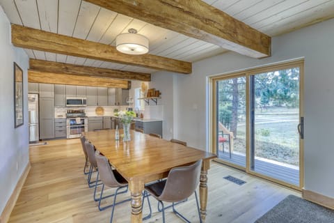 Dining room and patio grilling. Your guests are going to love this main floor living space with seperated bedrooms amongst the other two floors.
