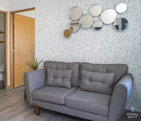 Kick back and relax on this cozy sofa. It's the ideal place to chill, recharge, and enjoy.