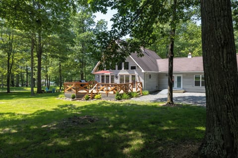 Home it tucked away in the trees. Enter through French doors.