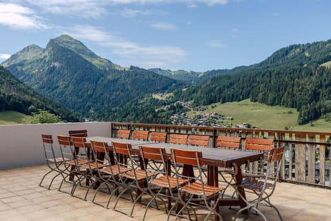 On the heights of Morzine on the way to Avoriaz, enjoy magnificent mountain views from the terrace of Chalet Les 4 Vents.