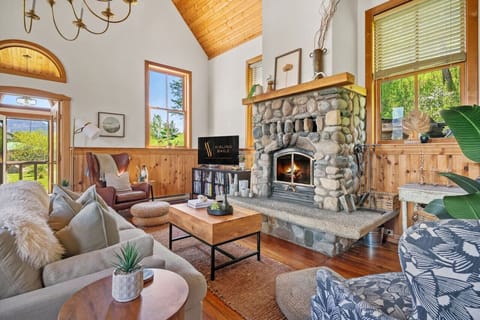 Grand living room with original hardwood floors, wood-burning fireplace, mountain views & other amazing amenities just waiting to be explored.