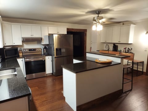 The newly renovated kitchen is spacious for your family to cook together.