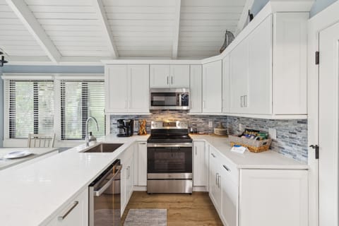 Completely renovated in 2024, the kitchen boasts all-new cabinets, countertops, and top-shelf appliances.