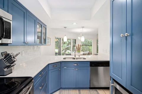 Quartz counters, stainless appliances and custom cabinets are features in this beautiful kitchen.