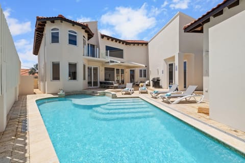 Bask in the luxury Our private pool is the ultimate retreat, where you can indulge in sun-kissed serenity and unparalleled relaxation