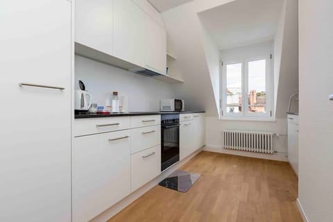 Bright and spacious -  fully equipped kitchen with Nespresso coffee machine, kettle, toaster, microwave, dishwasher, and a washing machine / dryer.