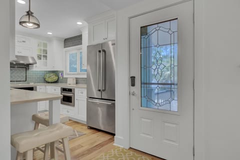 - Enter a kitchen that feels as good as it looks, with a decorative glass door & modern charm - Stainless steel finishes & hardwood floors blend elegance with everyday ease - Pull up a stool, pour a coffee, & feel right at home from the moment you arrive