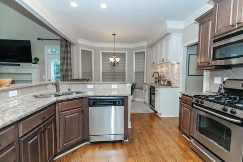 A well-equipped kitchen designed for comfort and convenience, offering modern appliances, plenty of prep space, and everything you need for a home-style stay.