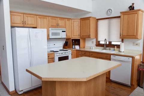Kitchen- Fully stocked and ready for cooking—plenty of prep space.