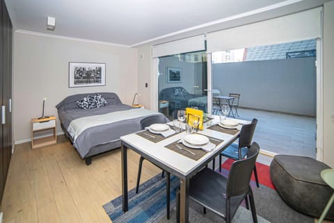 Cozy studio with a private patio, perfect for a relaxing stay in the heart of the city.
