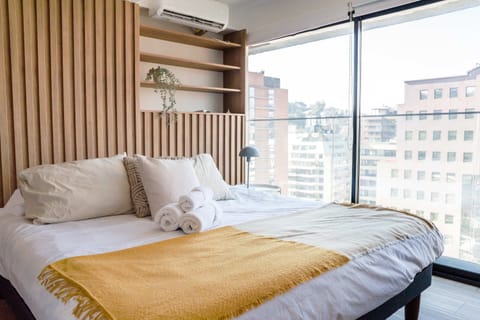 Relax in this stylish studio with stunning city views and modern comforts in the heart of Chile.