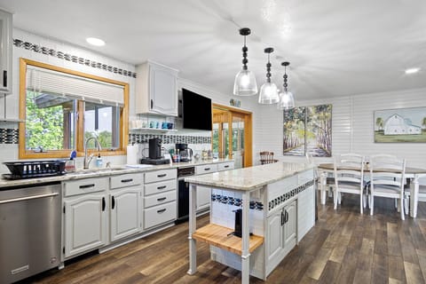 Full kitchen equipped with all essential cooking and eating needs.