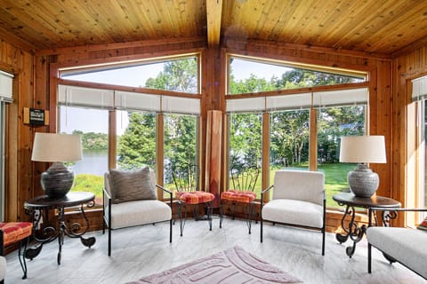 The sunroom off of the dining room/kitchen with stunning views of Lake Wissota.