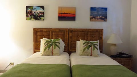 Settle into cozy twin beds after a beach-filled day.