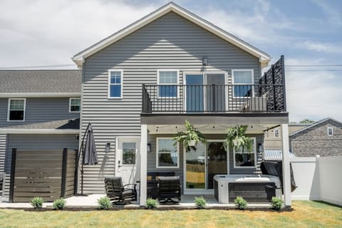 Spacious back patio & upper balcony offer inviting spots to relax & enjoy the fresh air