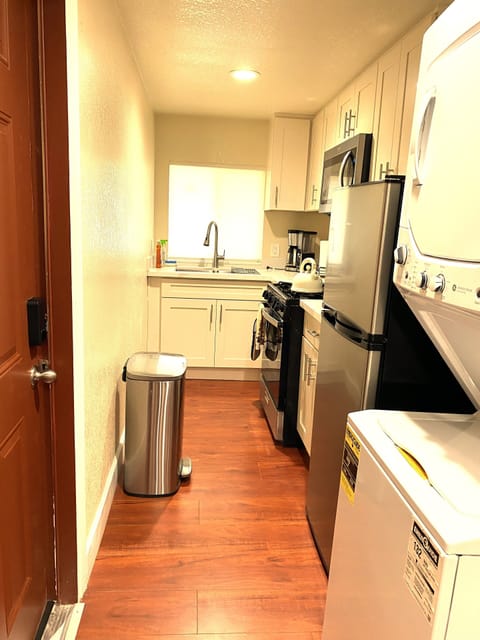 Kitchen & stackable washer and dryer area