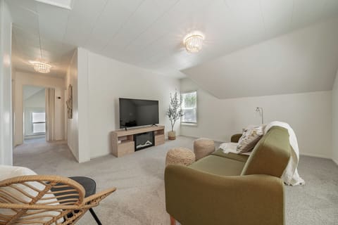 Light and airy living room with fold down couch for additional sleeping