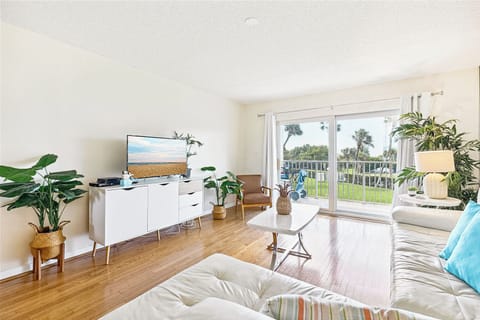 Coastal and bright living room filled with natural light and stylish decor