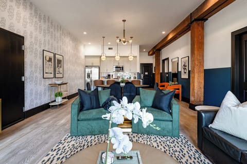 Relax in the living area with a smart TV, stylish seating, and a sleeper sofa for extra guests. Perfect for families or group stays in New Orleans, this inviting space is ideal for movie nights or recharging after a day in the city.