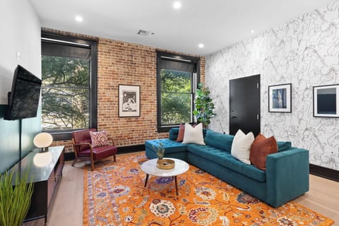 Relax in the living area with a smart TV, stylish seating and a sleeper sofa for extra guests. Perfect for families or group stays in New Orleans, this inviting space is ideal for movie nights or recharging after a day in the city.