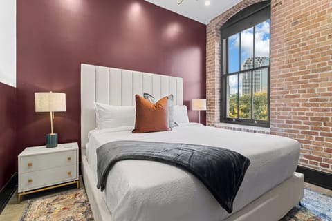 Retreat to the Primary bedroom with a plush king bed, walk-in closet, blackout shades, and a smart TV. Designed for comfort and privacy, this suite is perfect for recharging after a day exploring New Orleans.