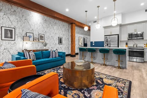 Relax in the living area with a smart TV, stylish seating, and a sleeper sofa for extra guests. Perfect for families or group stays in New Orleans, this inviting space is ideal for movie nights or recharging after a day in the city.