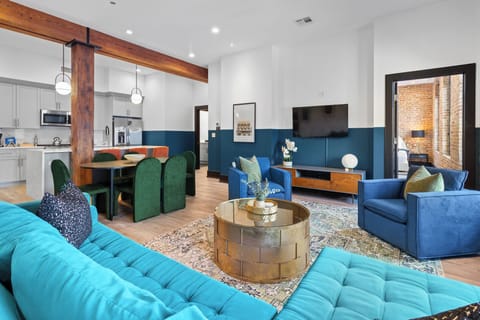 Relax in the living area with a smart TV, stylish seating, and a sleeper sofa for extra guests. Perfect for families or group stays in New Orleans, this inviting space is ideal for movie nights or recharging after a day in the city.