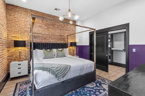 Retreat to the Primary bedroom with a plush king bed, walk-in closet, blackout shades, and a smart TV. Designed for comfort and privacy, this suite is perfect for recharging after a day exploring New Orleans.