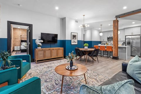 Relax in the living area with a smart TV, stylish seating, and a sleeper sofa for extra guests. Perfect for families or group stays in New Orleans, this inviting space is ideal for movie nights or recharging after a day in the city.