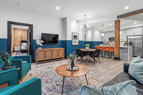 Relax in the living area with a smart TV, stylish seating, and a sleeper sofa for extra guests. Perfect for families or group stays in New Orleans, this inviting space is ideal for movie nights or recharging after a day in the city.