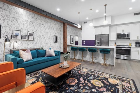 Relax in the living area with a smart TV, stylish seating, and a sleeper sofa for extra guests. Perfect for families or group stays in New Orleans, this inviting space is ideal for movie nights or recharging after a day in the city.