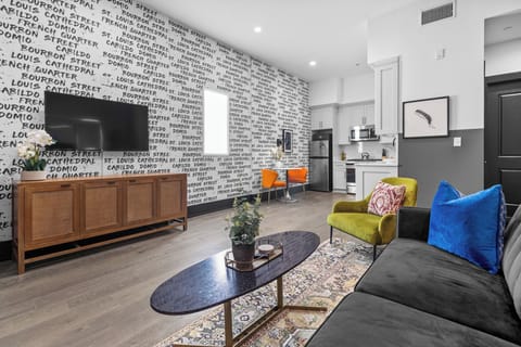 Relax in the living area with a smart TV, stylish seating, and a sleeper sofa for extra guests. Perfect for families or group stays in New Orleans, this inviting space is ideal for movie nights or recharging after a day in the city.