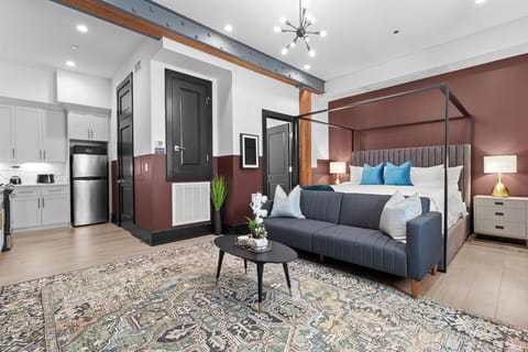 Relax in the living area with a smart TV, stylish seating, and a sleeper sofa for extra guests. Perfect for families or group stays in New Orleans, this inviting space is ideal for movie nights or recharging after a day in the city.