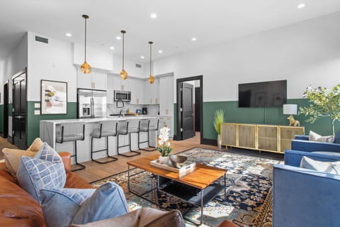 Relax in the living area with a smart TV, stylish seating, and a sleeper sofa for extra guests. Perfect for families or group stays in New Orleans, this inviting space is ideal for movie nights or recharging after a day in the city.