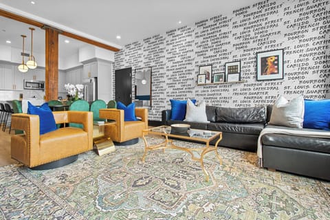 Relax in the living area with a smart TV, stylish seating, and a sleeper sofa for extra guests. Perfect for families or group stays in New Orleans, this inviting space is ideal for movie nights or recharging after a day in the city.