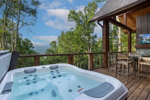 Hot Tub on the Main Floor Deck Overlooking the Mountains