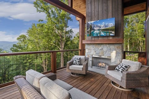 Outdoor Covered Living Area with Comfortable Furniture, Gas Fireplace and TV