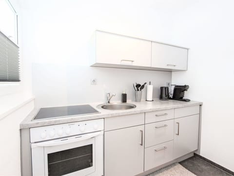 Countertop, Cabinetry, Building, Property, Furniture, Kitchen, Kitchen Appliance, Kitchen Stove, Sink, Tap