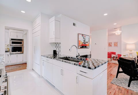 Stainless steel accents and sleek countertop elevate your cooking experience in this modern kitchen. ✨