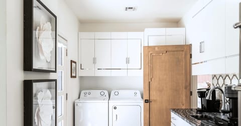 The laundry area is designed for convenience, making chores a breeze.