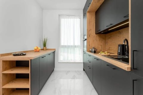 Kitchenette with a fridge.
