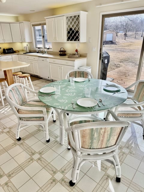 Eat-in, fully stocked kitchen with access to back deck and grill.  